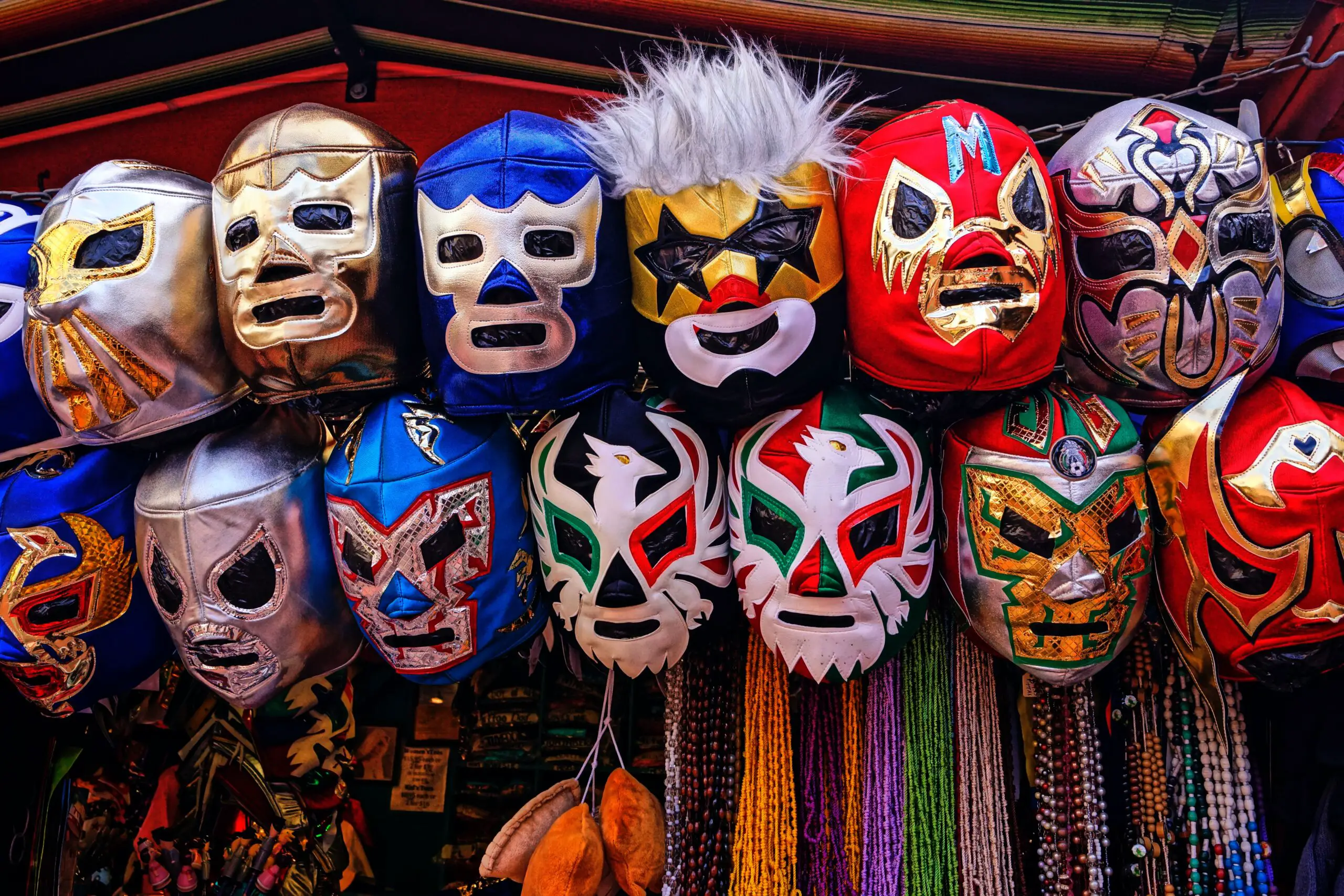 assorted-color of masks hanged on rod